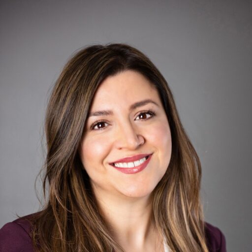 A photo of Professor Shoeleh Shams with a grey and white background.