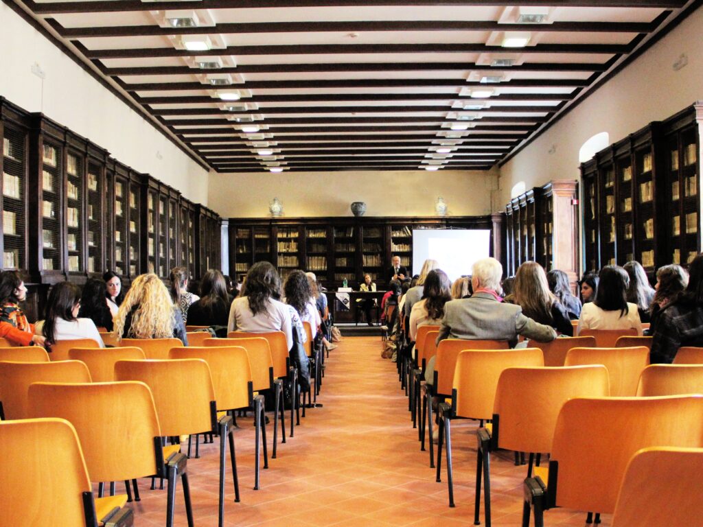 a photo of a group people in a classroom setting
