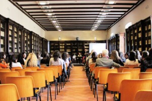 a photo of a group people in a classroom setting