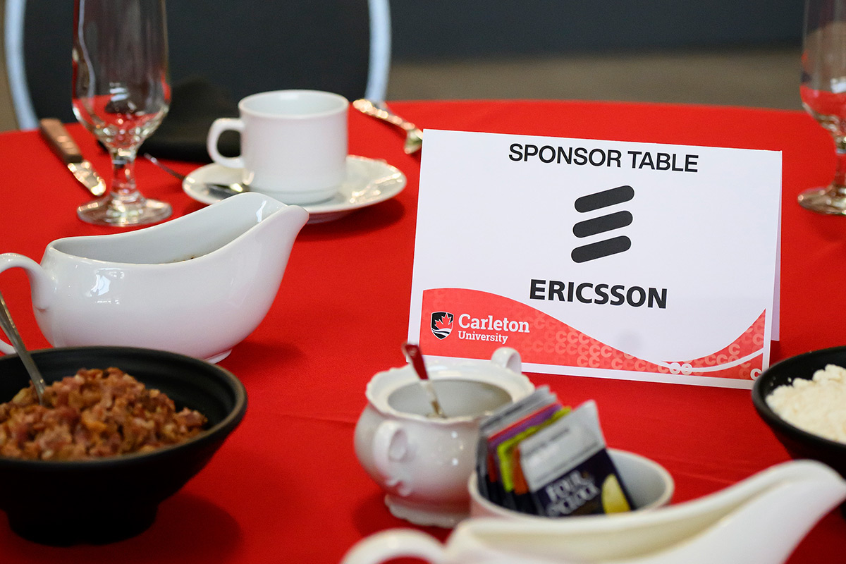 A sign on a table that reads Sponsor Table Ericsson.