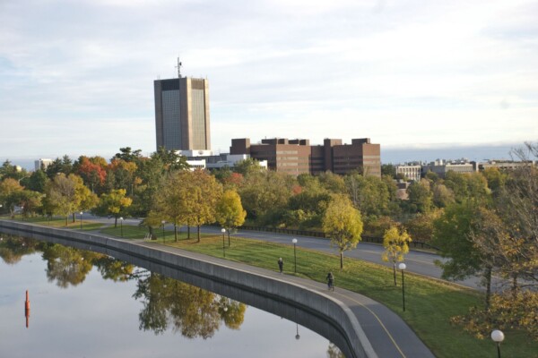 An image of Carleton campus as seen from the bridge above the Rideau Canal