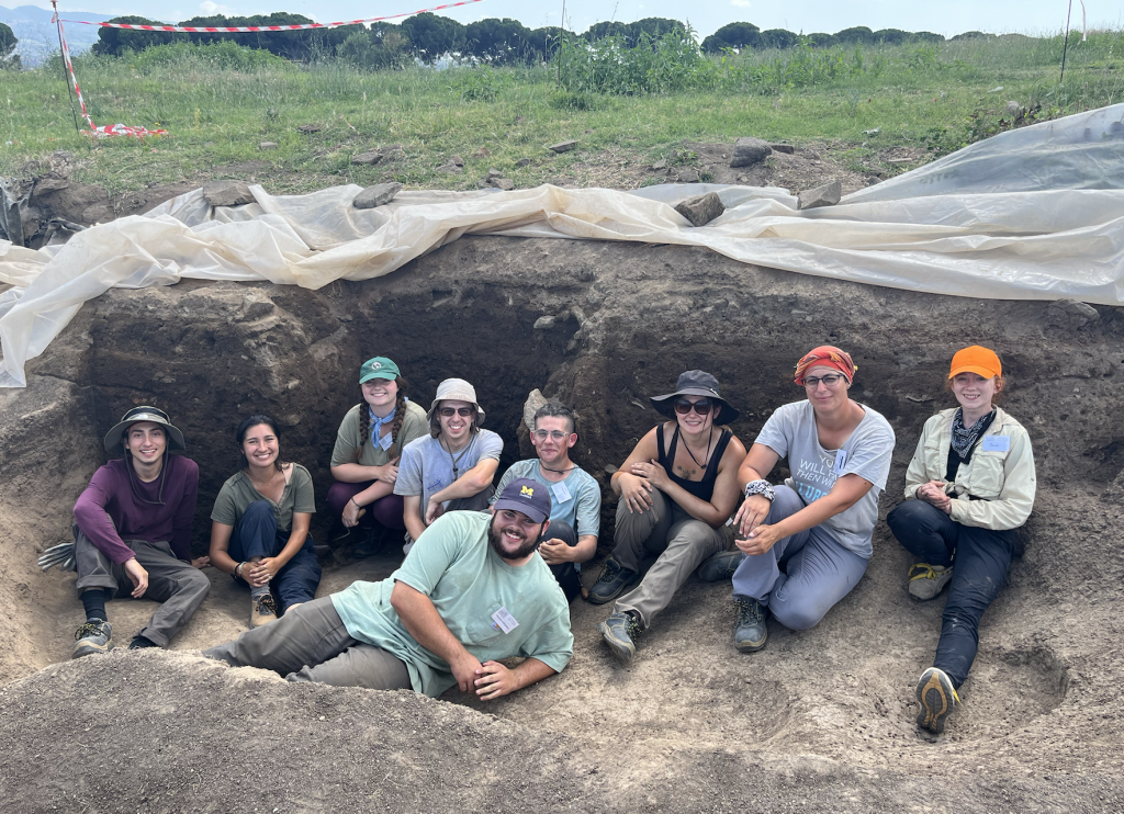 The 9 student team that excavated Iron Age huts in Gabii, Italy, including Carleton student, Jessie.