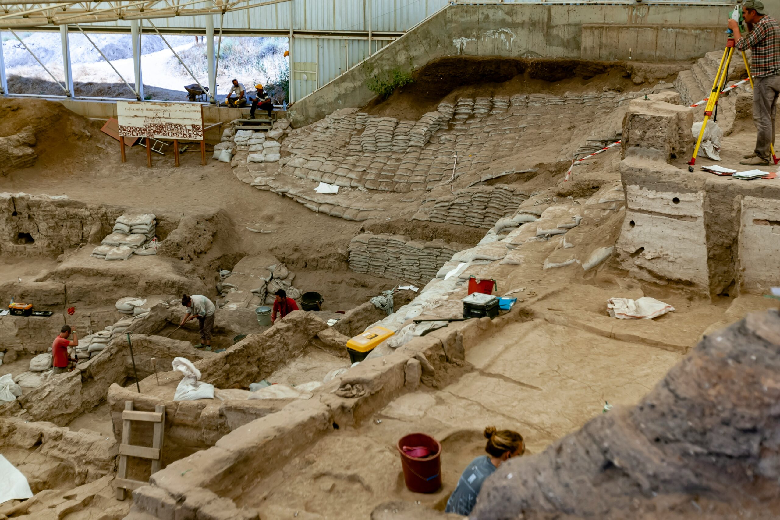 Çatalhöyük was a very large Neolithic proto-city settlement in southern Anatolia, which existed from approximately 7500 BC to 5700 BC, and flourished around 7000 BC. In July 2012, it was inscribed as a UNESCO World Heritage Site. It is located overlooking the Konya Plain, southeast of the present-day city of Konya (ancient Iconium) in Turkey. The eastern settlement forms a mound which would have risen about 20m above the plain at the time of the latest Neolithic occupation. There is also a smaller settlement mound to the west and a Byzantine settlement a few hundred meters to the east. (Wiki)