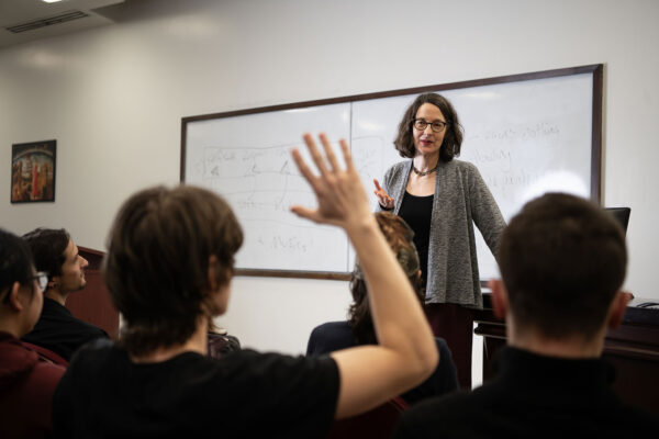 student raising their hand
