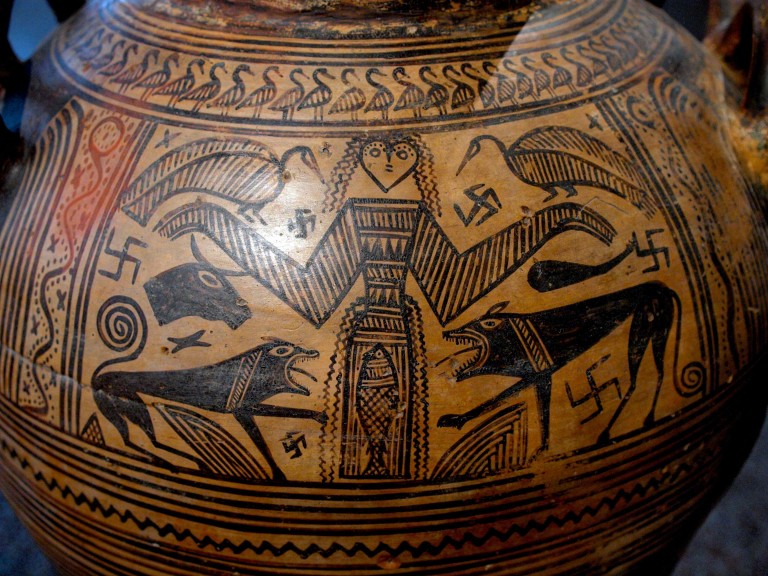 Mistress of the Animals, the great goddess of nature, flanked by lions, with dismembered bovine and birds in the background. 