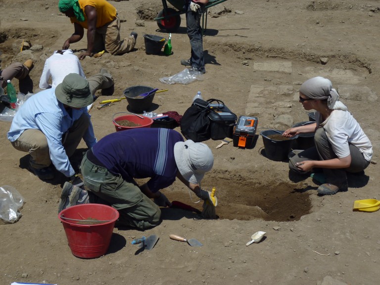 Undergraduate students excavate a human burial at Roman site in Italy.