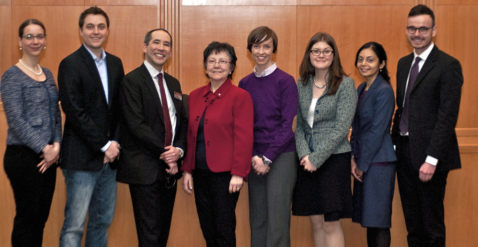 Caption: Supreme Court Justice Louise Charron with some of her former law clerks. Left to right: Palma Paciocco, Kirk Shannon, Graham Mayeda, Justice Louise Charron, Jena McGill, Vanessa MacDonnell, Parul Shah (B.Hum. 2002), and Kyle Kirkup (B.Hum. 2006).