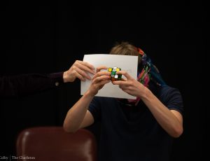 Photo of Antoine Cantin solving the Rubik's Cube blindfolded