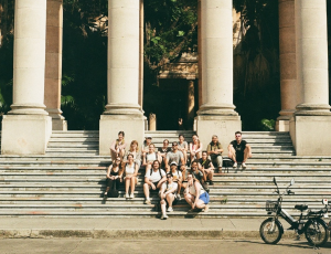 Students sitting on steps at campus of the University of Havana the main