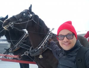 Fredy outside with horses