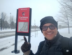 Fredy with Carleton sign