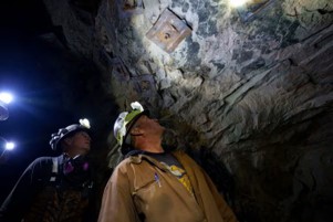 Man looking at minerals. Mining