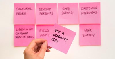 Post-it notes with "run a usability study" in focus