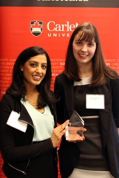 From left: Kelly Stone's colleague, Nina Suagh, accepting the 2016 Co-op Employer of the Year award on her behalf, with Rebecca Balcerzak, the co-op student who nominated Stone for the award. 