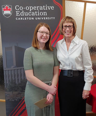 Undergraduate Co-op Student of the Year Honourable Mention, Sarah Falkowsky, standing with Kathleen Hickey, Manager of Co-operative Education. 