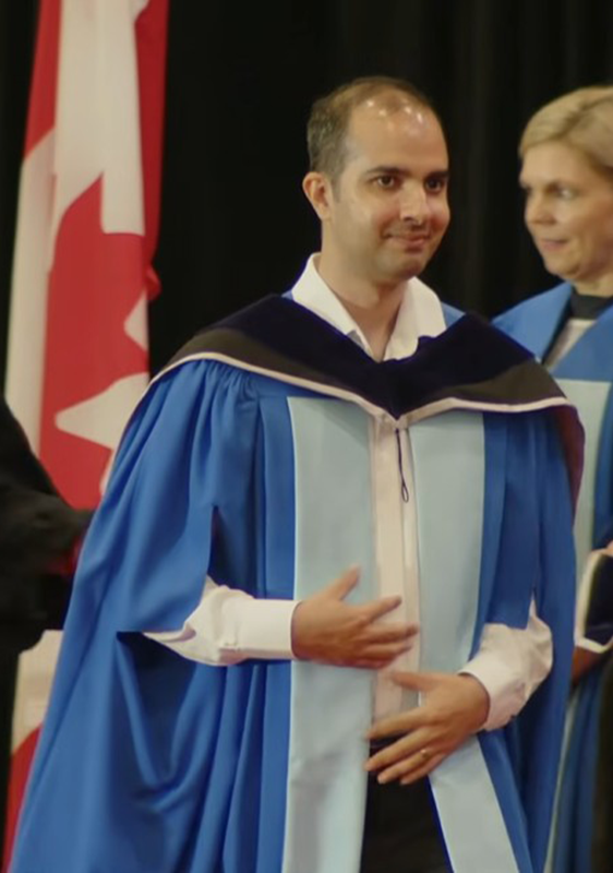 Phd graduate in graduation gown