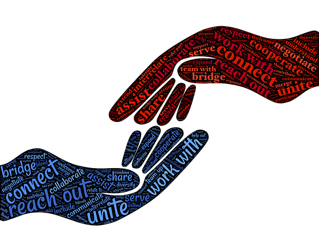 Drawing of two hands with messages of unity written on them.