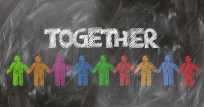 Picture of a blackboard with the word "together" written on it.