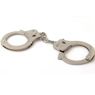 Silver handcuffs on white background
