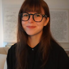 Photo of Sasha Valgardsson in an office-like setting wearing black shirt