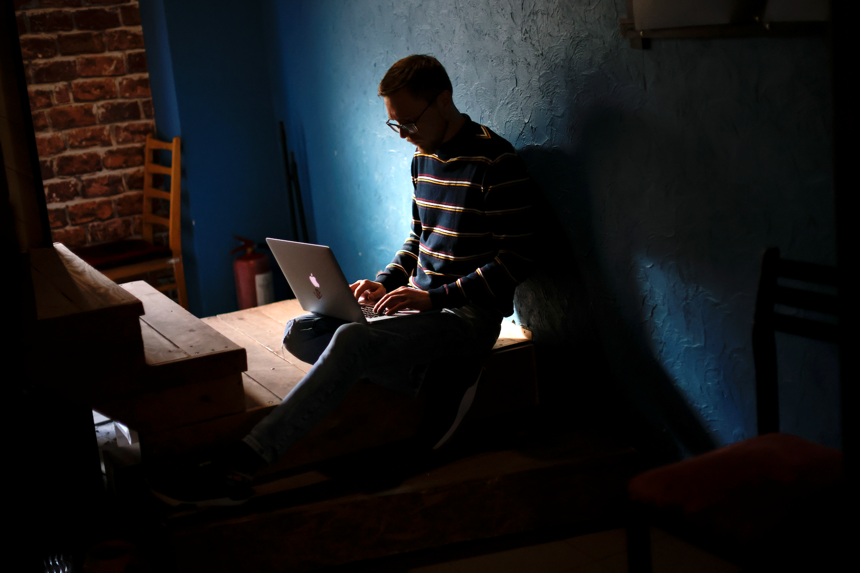 Ukrainian IT manager Andrew works at his computer amid the Russian invasion of Ukraine, in Odessa, April 6, 2022. (Ueslei Marcelino/REUTERS)