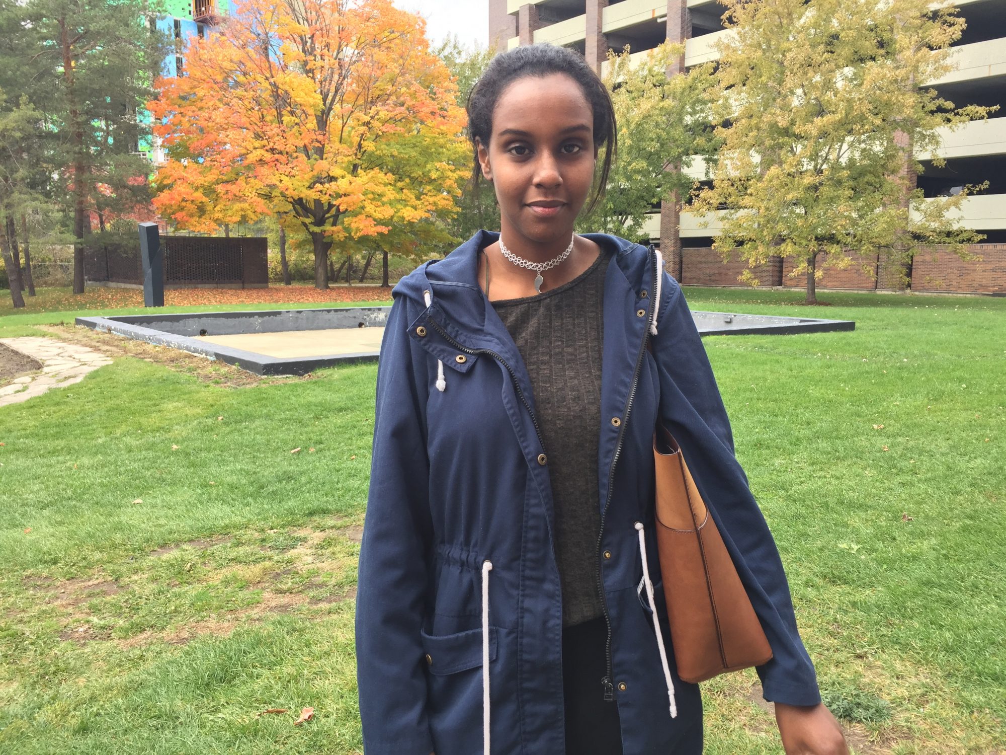 Student Mariam Omar, pictured here in Carleton's Alumni Park, was the winner of the CU75 History Quiz contest