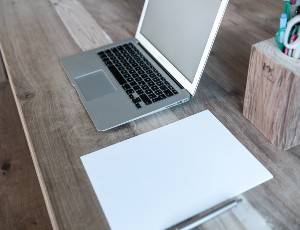 Picture of wooden desk and laptop
