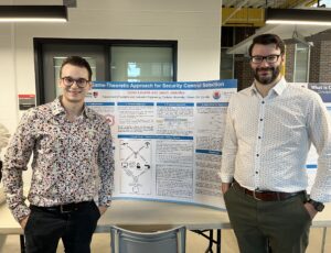 Jason Jaskolka and Dylan Léveillé with his poster "A Game–Theoretic Approach to Security Control Selection."