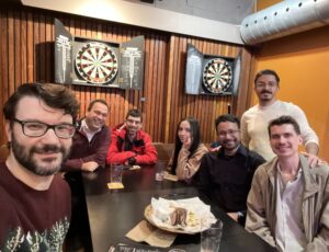 Members of the CyberSEA Research Lab gathering to celebrate the holidays and all of our accomplishments in 2025.