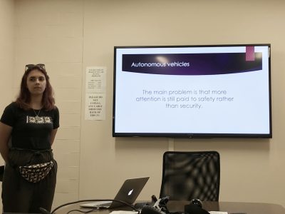 Bohdana Sereda discussing the problem faced when designing-in security in the domain of autonomous vehicles.