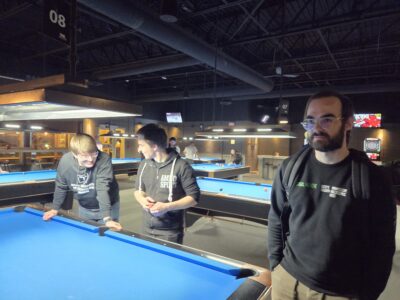 Enjoying some conversation over a game of billiards