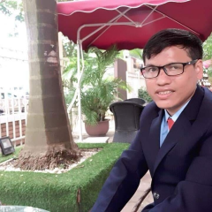 This is a portrait of a man wearing black glasses and a black suit.