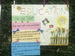 The manifestos delivers the written messages “Education. We are Deaf. Have equal rights to life and education. We are committed to the responsibility of focusing the problem and participating in the community’s experiential activities. Organize events, exchange activities, etc..To convey messages to the government and society concerned about schools for the Deaf, culture. E.g: grade level, school extension, allied group full industries.” The manifestos feature various images: four arms with four different colors woven into a square, a raised hand, and a map of Vietnam with the Hanoi landmark. 