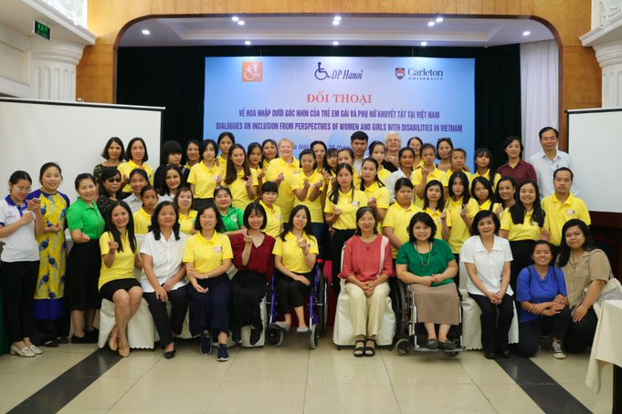 A group shot of girls and women with disabilities and community stakeholders. 