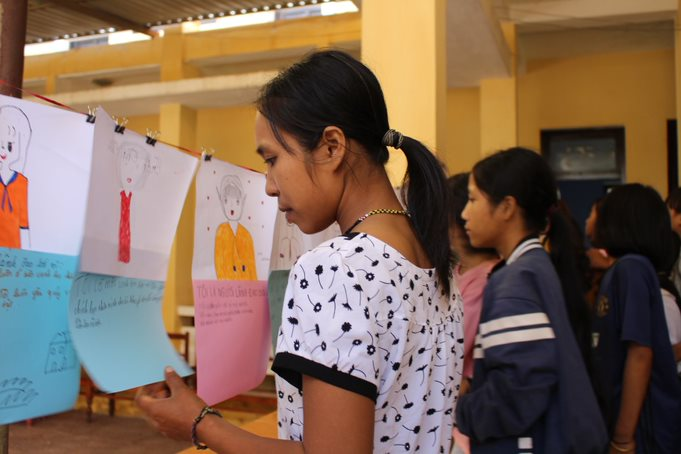 The participants view “ I Am A Leader Because…” exhibition