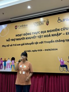 A woman is holding a mic.