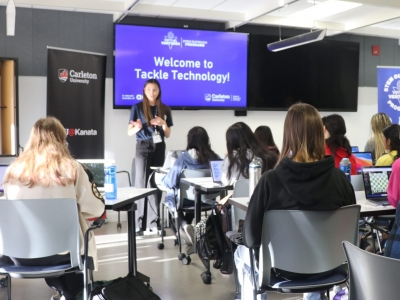 A Virtual Ventures instructor talks to a group of girls