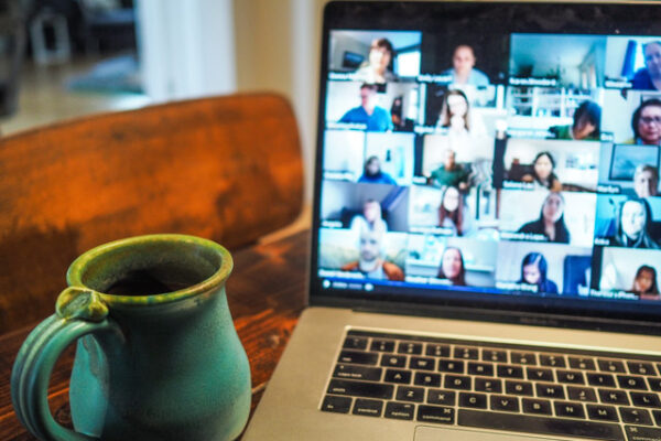 A laptop on a table with a Teams call on screen