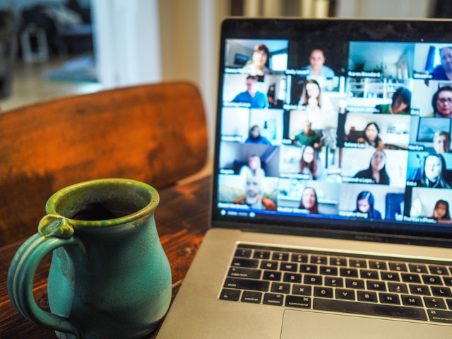 A laptop on a table with a Teams call on screen