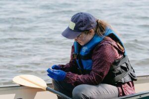 person in a canoe on a lake