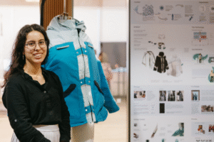 student standing in front of jacket prototype