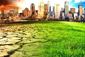 city landscape leftside is dark dreary and rightside green sunshine