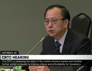 Professor Zhiqi Chen testifying at CRTC hearing, text in image reads crtc is reviewing the state of the mobile wireless market and whether further action is needed to improve choice and affordability for Canadians