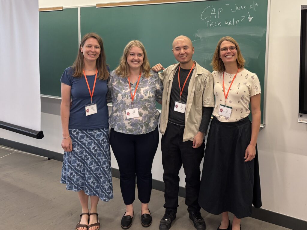 Image of Dr. Rowan Thomson, Dr. Alisha Szozda, Dr. Hongwei Zhou, and Dr. Maïté Dupuis of Perimeter Institute after their symposium talk.