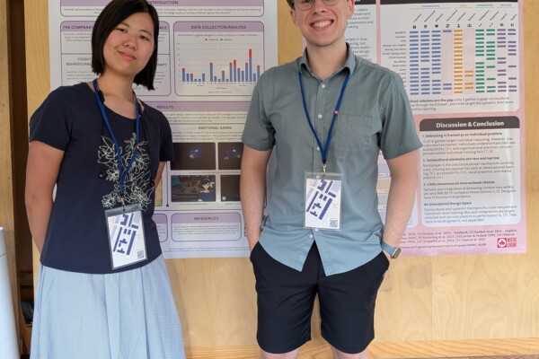 Image of Annie and Joey at the conference with their posters.
