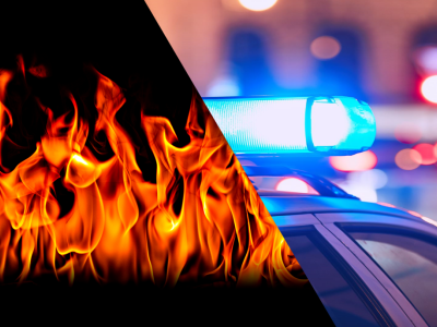 Photo of fire on left and police lights on right.