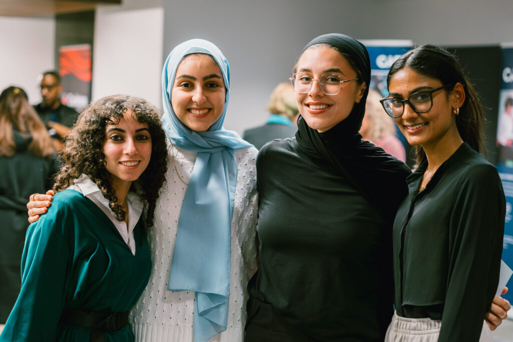 Four women standing