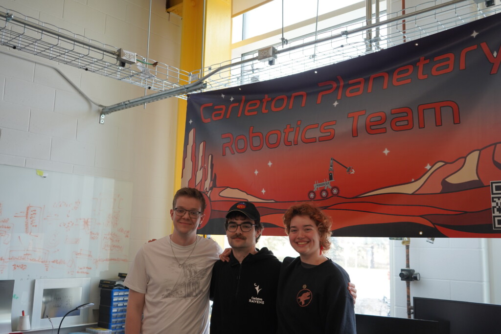 Group photo of members of the CPRT team, in front of the team's banner. 