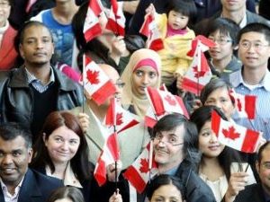 Canadians holding Canadian flags