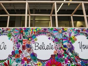 An art piece that says "We Believe You"